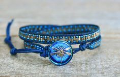 This beautiful double leather wrap bracelet has sparkly silver and blue beads woven on dark blue leather cord.   Dragonfly button with a 3 loop closure.  Wear alone or stack with your favorites. Well made and beautiful!  Bracelet size: 6 1/2"-7 1/2" (adjustable loops) Please note that pictures are taken up close to show detail. Therefore, this bracelet looks larger in the pictures than it is in person. Due to monitor settings and preferences, colors may appear slightly different on screen than in person. As each computer monitor is calibrated differently, there may be slight but not drastic color variances between the item and the image you see on the screen. ¤'¨) ¸.*'¸.**'¨) ¸. Thank you for visiting!! (¸.*' (¸. --------------------------------------------------------- Follow me on: http: Blue Beaded Leather Bracelet For Gift, Adjustable Hand Wrapped Blue Leather Bracelet, Adjustable Blue Leather Bracelet As Gift, Adjustable Blue Leather Bracelet Gift, Dragonfly Jewelry, Beaded Wrap Bracelets, Wrap Bracelets, Beach Crafts, Boho Bracelet