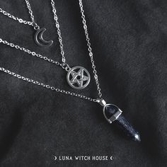 This most beautiful set of 3 silver coloured necklaces make a great witchy trio accessory.  This set is made of 3 single necklaces (they are not attached) so you can wear all together or individually.  - Material Type: Alloy & Natural Stone - Moon Necklace Length: 7.8 inches - Pentagram Necklace Length: 9 inches - Crystal Necklace Length: 11 inches All necklaces are inside a material pouch and then carefully placed inside an envelope lined with bubble wrap to ensure no damage in transit. *Please Sterling Silver Witchy Necklace For Gift, Witchy Sterling Silver Necklace For Gift, Witchy Metal Necklaces For Gift, Mystical Handmade Silver Charm Necklace, Witchy Silver Jewelry Gift, Enchanting Silver Necklace, Witchy Metal Jewelry With Moon Charm, Handmade Silver Layered Necklace Gift, Handmade Silver Layered Necklace For Gift