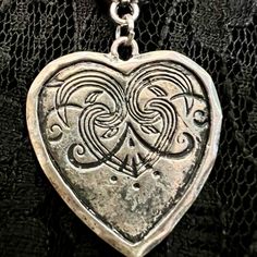 Melancholia Swirly & Silvery Large Distressed Heart Pendant On A Black Corded Necklace. The Cord Measures 17.5” In Length Plus A 2” Chain Extension Topped Off With A Crooked Heart Charm That Will Look Great Dangling Down The Back Of Your Neck. This Piece I Call Melancholia Because It Reminds Me Of A Sad Heart With A Brave Face. Vintage Pendant And Charm. Please Share If You’re Not Interested. Thanks. Nickel Free Heart Shaped Jewelry For Festivals, Nickel-free Heart-shaped Jewelry For Festival, Gothic Silver Heart Necklace, Silver Gothic Heart Necklace For Valentine's Day, Gothic Silver Heart Necklace For Valentine's Day, Bohemian Silver Heart Necklace, Silver Gothic Heart Charm Necklace, Silver Gothic Necklace With Heart Charm, Silver Gothic Jewelry With Heart Charm