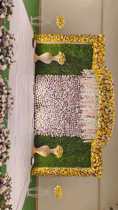 an arrangement of flowers and other decorations on display