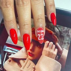 Whether you’re headed to the Eras Tour or simply in the heart of your Taylor Era, we’ve got lots of Taylor Swift nail ideas for you to look through and fall in love with—like these simple Red-inspired nails with sparkly "Feelin' 22" nail art! Taylor Swift Red Album Inspired Nails, Taylor Swift Eras Nails With Ttpd, Swiftie Nails, Taylor Swift Nail Ideas, Taylor Swift Nails Inspired, Swift Nails, Taylor Swift Red Album, Taylor Nails, Taylor Swift Nails