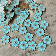 blue flowers with gold accents on a marble surface