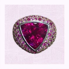 A gorgeous 12.21 carat trillion cut rubellite that is surrounded by an ombre of diamonds and pink sapphires. Made of 5.65 carats of delicate pink sapphires and 1.80 carats of white diamonds, all are set in 18k white and rose gold. This statement ring is very unique and a real eye catcher! Ring With Diamond, Gorgeous Jewelry, White Diamonds, Cocktail Ring, Pink Sapphire, Cocktail Rings, Statement Ring, Diamond White, Statement Rings