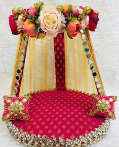 a pink and gold bed with flowers on it