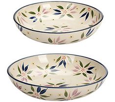 two bowls with floral designs on them are sitting side by side in front of each other