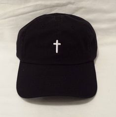 "Custom Embroidered \"Christian Cross\" Hat. This is a black low profile, unstructured baseball hat with a white embroidered cross on the front of the hat. We also offer this design on a sun visor at the ad below: https://www.etsy.com/listing/579892619 If you would another thread color or another color hat, please contact us, we will be happy to provide other colors options upon request (several choices are available) Hat Details: - Brushed Cotton Twill - Untructured (soft material above the vis Trendy Caps, Christian Hats, Christian Shirts Designs, Embroidered Cross, Types Of Hats, Embroidered Cap, Embroidered Hat, Embroidered Baseball Caps, Embroidered Caps