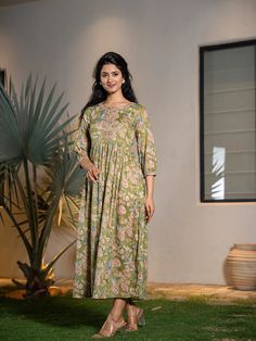 This is a beautiful single piece set. The set comes with flared maxi style dress has floral print & dori embroidery detailing, round neck, 3/4th sleeves & ankle length. Total No of Set-1 Gown Fabric: Cotton Color: Green Work Done - Floral Print & Sequins Detailing. Kurta Length-Ankle Length Sleeve Length: 3/4th sleeves Neck: Round Neck Style: Maxi Style Occasion: Party Wear Washing Instructions: Machine Wash Green Anarkali Set With Floral Print And Long Sleeves, Green Long Sleeve Anarkali Set With Floral Print, Green Floral Print Long Sleeve Anarkali Set, Spring Green Anarkali Set With Floral Print, Floor-length Anarkali Set For Spring, Spring Green Floral Print Anarkali Set, Green Floral Embroidery Maxi Length Set, Green Floral Print Maxi Length Set, Green Floral Print Maxi Set