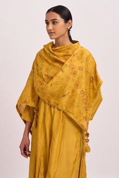 Mustard embellished kurta with three-fourth sleeves. Paired with a floral chanderi scarf and pant.
Component: 3
Pattern: Embroidered,Printed
Type Of Work: Floral Motifs
Neckline: Round
Sleeve Type: Three-fourth Sleeves
Fabric: Kurta and Pant: Cotton Silk, Scarf: Chanderi
Color: Yellow
Other Details: 
Tasselled scarf
Pleat detailing
Back keyhole
Closure:
Kurta: Side zip
Occasion: Puja - Aza Fashions Unstitched Traditional Wear With Printed Motifs For Reception, Festive Salwar Kameez With Printed Motifs For Reception, Transitional Chanderi Dupatta With Printed Motifs, Chanderi Dupatta With Printed Motifs For Reception, Reception Dupatta With Printed Motifs In Chanderi, Traditional Wear With Printed Motifs For Reception, Printed Motifs Dupatta For Eid Reception, Festive Gold Salwar Kameez With Printed Motifs, Printed Motifs Dupatta For Reception And Eid