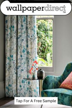 a blue chair sitting in front of a window