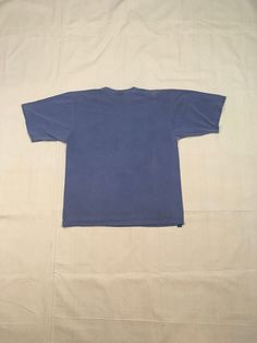 "1990s are neck t-shirt Fast Company cotton dyed blue, a little more muted then photos most like bottom tag 'fast' photo made in USA good vintage condition, light wear color fade, uneven bleached out spots fits like XL, labeled ML, see below measures, lying flat, shoulder-21 1/2\" chest-23 1/2\" sleeve-10 3/4\" length-29 1/2\"" Blank T Shirt, Fast Company, Blank T Shirts, Blue Crewneck, Long Sweaters Cardigan, Levis Denim, Blue T Shirt, Blue T, Blue Tshirt