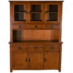 a wooden hutch with glass doors and drawers