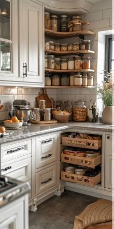 a kitchen filled with lots of different types of food in boxes and containers on the counter