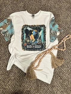 Where's my 80's peeps?!  This custom Bud & Sissy tee features accented sleeves to add to the appeal of this awesome shirt! Available in youth sizes up to adult 3xl. Urban Cowboy, Cool Shirts, Art Collection, Cowboy, Bathing Beauties, Gender Neutral, Adult Outfits, Tops & Tees, Top Outfits