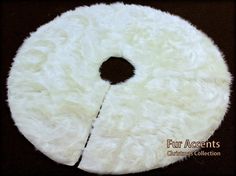 a white fur rug with a hole in the center on a black background that says fur accents