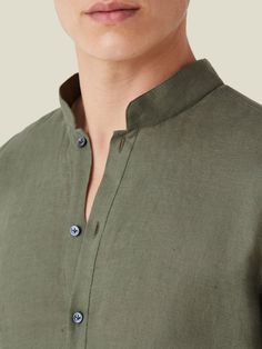 The Forte linen shirt features a band collar with buttons opening to the chest, for a casual and effortless summer look. Made in Bergamo, in Northern Italy, by skilled artisans with the finest Italian pure linen and mother of pearl buttons. Learn about the properties of linen and how to wear it, and discover what makes our linen unique. Casual Linen Top With Stand Collar, Classic Summer Shirt With Stand Collar, Green Linen Tops With Placket, Linen Henley Neckline Tops For Summer, Linen Tops With Henley Neckline For Summer, Summer Linen Tops With Henley Neckline, Relaxed Fit Linen Shirt With Collar, Band Collar, Evening Attire