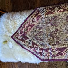 the rug is laying on top of the wooden floor