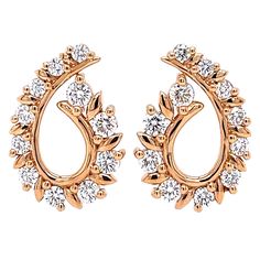 These captivating diamond earrings boast a dazzling 1.45 total carat weight of round brilliant diamonds, set in luxurious 18K rose gold. The soft, feminine blush of the rose gold beautifully complements the sparkling diamonds, creating a look that is both romantic and elegant. What makes them special: -Delicate scintillation: With 22 sparkling round brilliant diamonds, these earrings offer a delightful interplay of light and sparkle, catching the eye with every movement. -Timeless design: The classic design of these earrings ensures they will never go out of style, making them a treasured piece for years to come. -Warm and inviting: The 18K rose gold adds a touch of warmth and femininity to the earrings, making them perfect for those who love a touch of pink. -Comfortable and secure: The e Luxury Rose Cut Diamond Earrings For Festive Season, Luxury Rose Gold Halo Design Earrings, Earrings Making, Soft Feminine, Rose Gold Diamonds, Brilliant Diamond, Jewelry Earrings Hoops, Sparkle Diamonds, Diamond Clarity