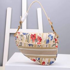 Size: 25.5 × 20 × 6.5cm “D” accent at front flap Antique gold finish metal Can be worn as a belt, on shoulder, crossbody or as a clutch Large interior compartment and 1 patch pocket Multicolor Flowers, Flowers Embroidery, Saddle Bag, Embroidery Flowers, Clutch Wallet, Free Giveaway, Vuitton Bag, Fashion Games, Saddle Bags