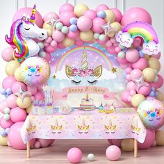 a unicorn themed birthday party with balloons and decorations