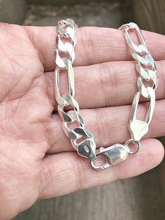 ◆Solid .925 Sterling Silver 8mm Figaro Link Bracelet◆ ◆Length: 8 inches   ◆ Strong made, 8mm wide. 220 gauge. ◆ Stamped 925 Italy, for Authenticity.  ◆ Finished with Lobster clasp, 17.7 grams ◆100% Genuine, 925 Sterling Silver    Arrives in a small gift box Exchanges: We do not resize our Bracelets. If you wish to exchange your Bracelet for a different one listed, you can request an exchange. You will be invoiced any difference in price including shipping. If wish to return your Bracelet, we wou Heavy Chain Necklace, Mens Wedding Rings Gold, Mens Chain Bracelet, Heavy Chain, Link Chain Bracelet, Silver Chain Style, Silver Chain Bracelet, Sterling Silver Mens, Mens Wedding Rings