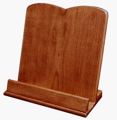 a wooden stand with a heart shaped object in it's center and bottom section