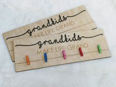 two wooden signs that say grandkids make life grand