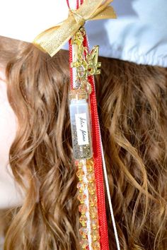 a close up of a woman's head with long hair and a ribbon on it