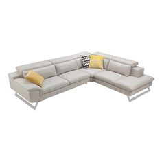 a gray leather sectional sofa with yellow pillows on it's back and side ends