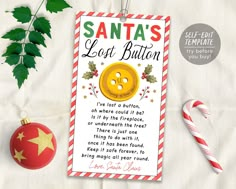 a santa's lost button christmas ornament next to candy canes