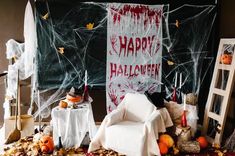 a halloween scene with pumpkins and decorations