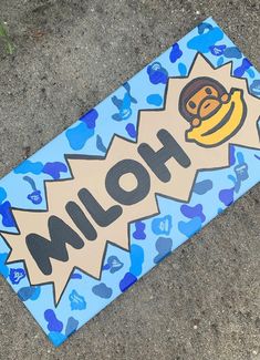 a blue skateboard with an image of a cartoon character on it's side