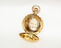 Victorian 14K Gold Watch Case Photo Keepsake Locket Pendant Formal Yellow Gold Medallion Watch, Victorian Yellow Gold Pocket Watch For Anniversary, Antique 14k Yellow Gold Watch, Victorian Yellow Gold Watches For Anniversary, Heirloom Engraved Yellow Gold Pocket Watch, Antique Yellow Gold Round Watches, Victorian Yellow Gold Anniversary Watch, Heirloom Yellow Gold Polished Watch, Elegant Engraved Yellow Gold Pocket Watch