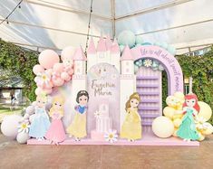 there are many princesses on the stage at this birthday party with balloons and decorations