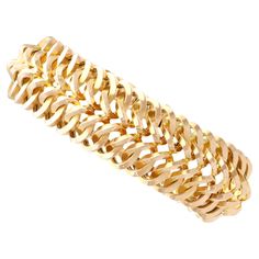 An exceptional, fine and impressive vintage French 18 karat yellow gold bracelet; part of our diverse vintage French jewellery collections. This exceptional, fine and impressive vintage gold bracelet has been crafted in 18k yellow gold. The substantial multi-dimensional articulated bracelet consists of interlacing curvilinear links, conjoined within a repeating chevron pattern; this well-made design has been crafted in a pleasing tactile manner. This 1960s gold bracelet secures to the reverse wi Vintage Gold Bracelet, Vintage Gold Earrings, French Jewelry, Antique Coins, Gold Armband, Yellow Gold Bracelet, Coin Pendant, Chevron Pattern, Vintage Bracelets