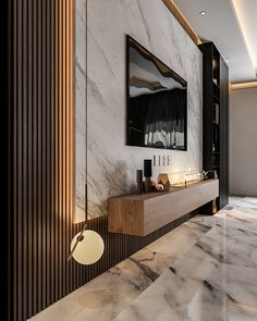 a bathroom with marble walls and flooring next to a mirror on the wall above it