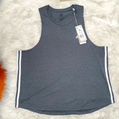 Nwt: Adidas Womens Athletic Tank; All Gray With 3 White Stripe Trefoil On Each Side. White Adidas Logo On The Top Left-Side Of The Tank. Aeroready Logo On The Back Bottom Right-Side. Great For The Active Woman!And Offers Are Always Welcome! Adidas Tops For Gym In Spring, Adidas Tops For Gym, Spring Season, Spring Adidas Tops For Gym, Adidas Cotton Gym Tops, Adidas Cotton Tank Top For Spring, Adidas Sporty Cotton Tank Top, Adidas Casual Cotton Tank Top, Casual Adidas Cotton Tank Top, Adidas Crop Top