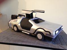 a car shaped cake sitting on top of a table