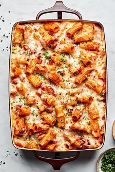 a casserole dish filled with pasta and sauce