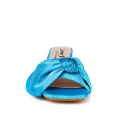 If you're looking for a touch of luxury, look no further than our Kolkata velvet slippers. With their comfortable heel, these slippers are perfect for a night on the town or a day of relaxation. Made with a beautiful velvet upper, they'll add some glamor to any outfit. The velvet upper provides a plush feel while the 2.5” block heel gives you an extra boost of lift. Plus, the slip-on design is easy to take on and off, making this ideal for any special occasion. Whether you're dressing up or dres Summer Party Fabric Heels, Chic Fabric Sandals With Block Heel, Fabric Heels With Wrapped Heel, Open Toe Fabric Sandals With Wrapped Heel, Party Heels With Padded Heel In Fabric, Fabric Open Toe Sandals With Wrapped Heel, Chic Fabric High Heels, Chic Summer Fabric Heels, Chic Fabric High Heel Heels