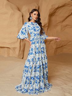 Elegant Spring Dress With Ikat Print, Floral Print Vacation Dress For Eid, Floral Print Floor-length Maxi Dress For Eid, Floral Print Dress For Eid Vacation, Eid Ikat Print Dress, Bohemian Ruffle Sleeve Dress For Vacation, Floral Print Beach Dress For Eid, Bohemian Dress With Ruffle Sleeves For Vacation, Elegant Floral Print Maxi Dress For Eid