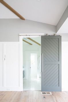 an open door leading into a white room