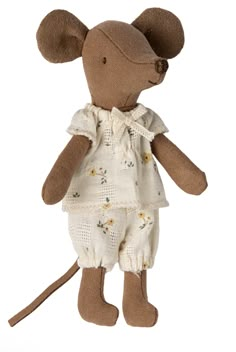 a stuffed mouse is wearing a white dress