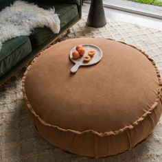 a round ottoman with some food on it