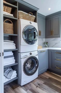 a washer and dryer sitting in a laundry room next to each other on shelves