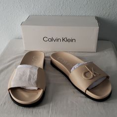 Cream Leather Blending '90s Minimalism With The Brand's Sophistication This Leather Slide Is Subtly Detailed With Matte Logo Hardware. Calvin Klein Slip-on Sandals For Summer, Calvin Klein Casual Slip-on Sandals, Calvin Klein Casual Sandals For Summer, Casual Calvin Klein Slip-on Sandals, Casual Calvin Klein Sandals For Summer, Calvin Klein Synthetic Slip-on Sandals, Calvin Klein Spring Slip-on Sandals, Trendy Calvin Klein Open Toe Sandals, Calvin Klein Open Toe Sandals With Cushioned Footbed