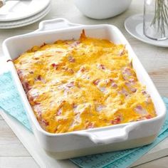 a casserole dish with ham and cheese