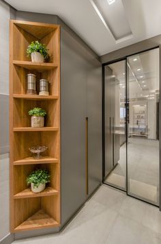 an open shelving unit in a bathroom next to a sink