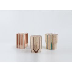 three wooden objects sitting on top of each other