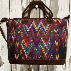 Brand New With Tags Huipil Bag. Overnight Bag Features An Adjustable Strap, Exterior Zippered Pocket, Interior Zippered Pocket And Metal Feet On The Bottom. Made By Indigenous Guatemalan Artisans For Gypsies + Debutantes. All Bags Are Made With Real Leather And Suede. Measurements: 20" Across 15.5" High 7" Deep Multicolor Hobo Bag With Detachable Handle For Shopping, Multicolor Satchel Hobo Bag For On-the-go, Red Leather Handle Pouch Bag, Multicolor Top Handle Bag With Detachable Handle, Multicolor Top Handle Shoulder Bag With Adjustable Strap, Multicolor Hobo Bag With Removable Pouch, Multicolor Hobo Shoulder Bag With Detachable Handle, Multicolor Detachable Handle Hobo Shoulder Bag, Multicolor Top Handle Hobo Bag With Adjustable Strap