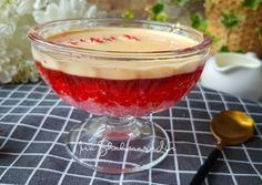 a dessert in a glass bowl on a table